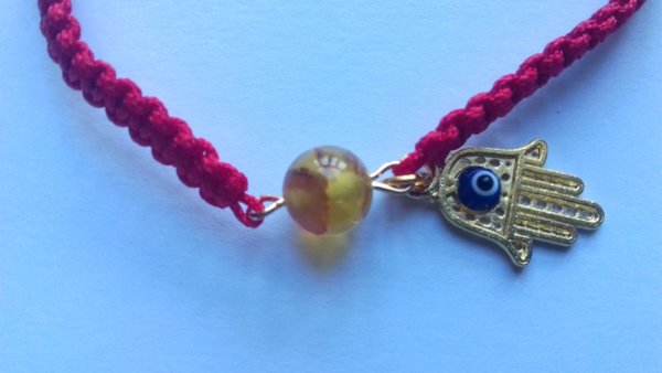 Bracelet talisman avec perle  ambre